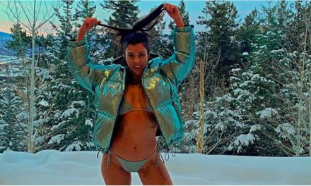 Kourtney Kardashian Silver Bikini and also Bomber in the Snow